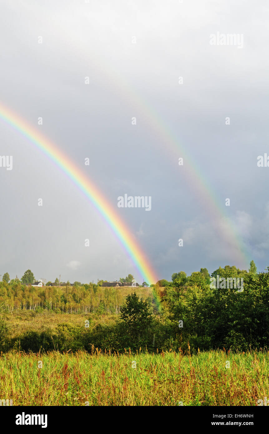 Village rainbow landscape Stock Photo - Alamy