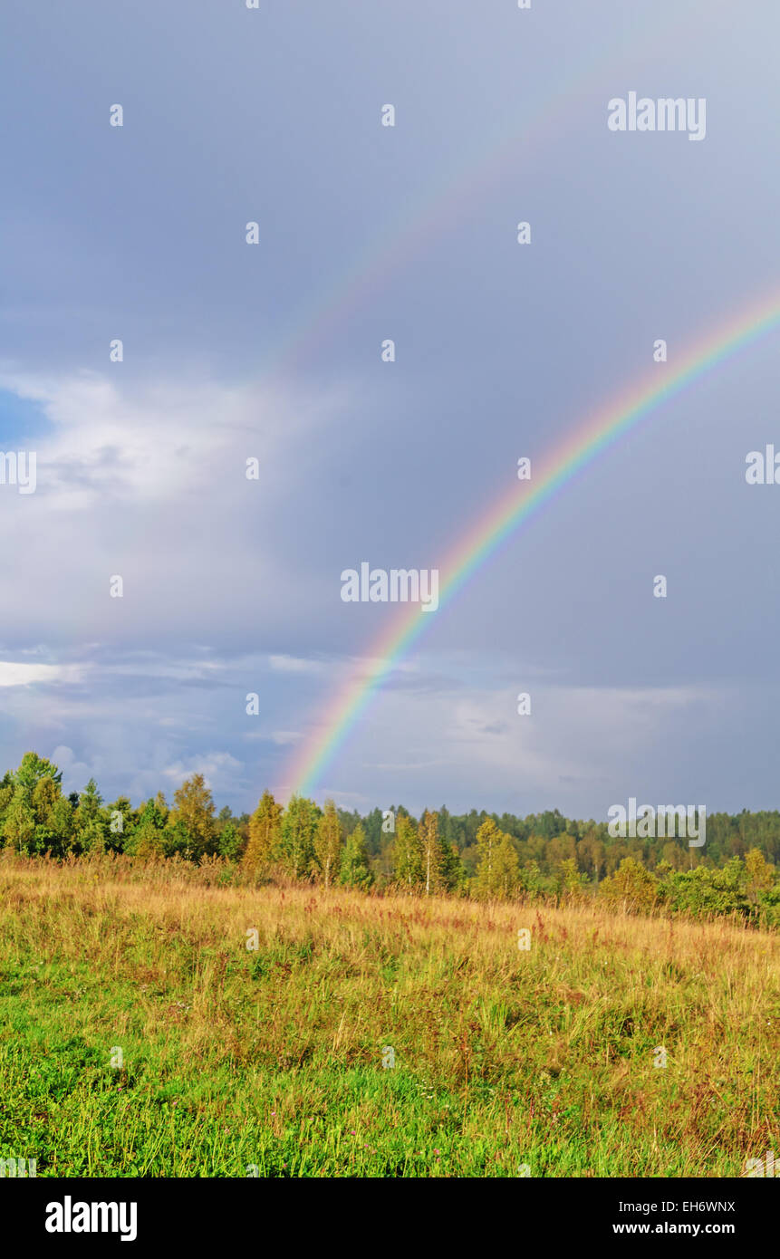 Village rainbow landscape Stock Photo - Alamy