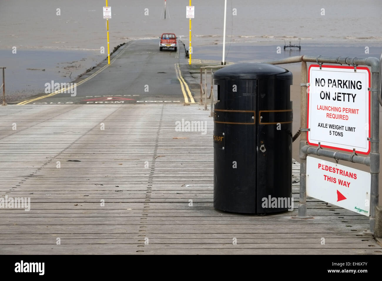 Truck parked on a Jetty behind a No Parking on Jetty sign 8th March 2015 Stock Photo