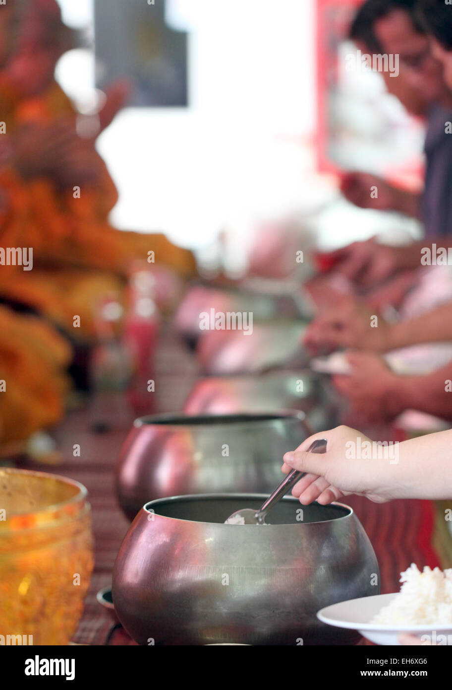 Giving for monks in ritual religion Thailand. Stock Photo