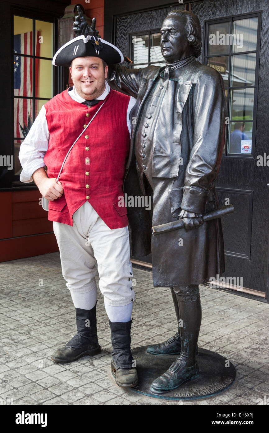 Boston Tea Party Museum, patriot standing beside Samuel Adams sculpture