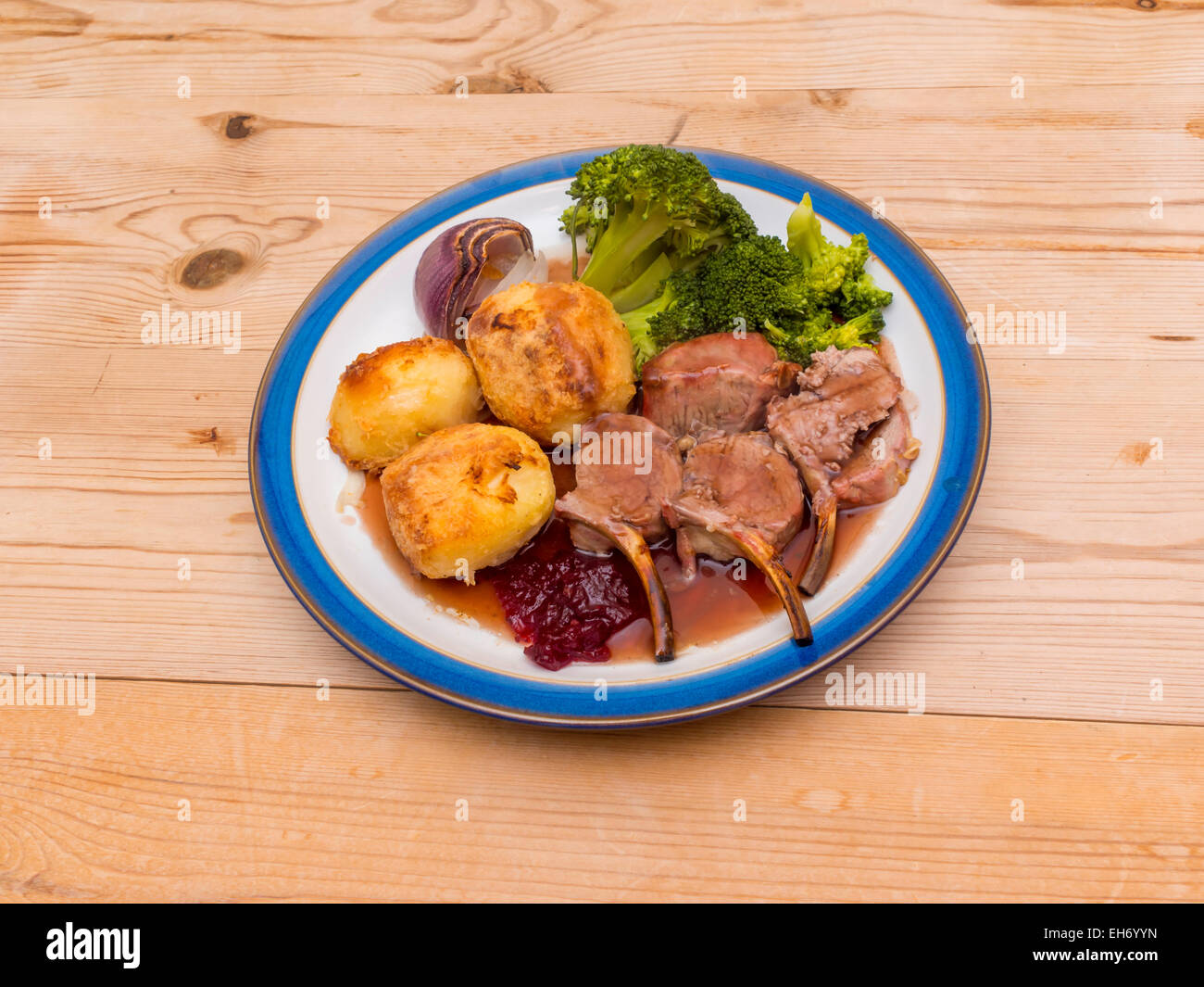 English dinner Roast rack of lamb broccoli onion and gravy served on a
