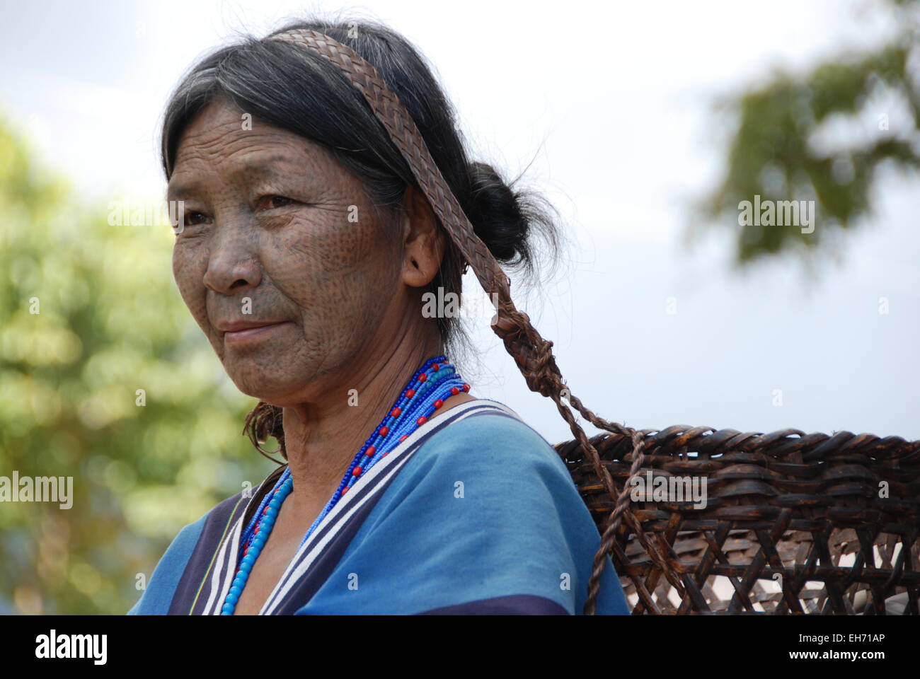 Chin Tribal Woman with Tattooed Face and basket, Kanpetlet Chin Village ...