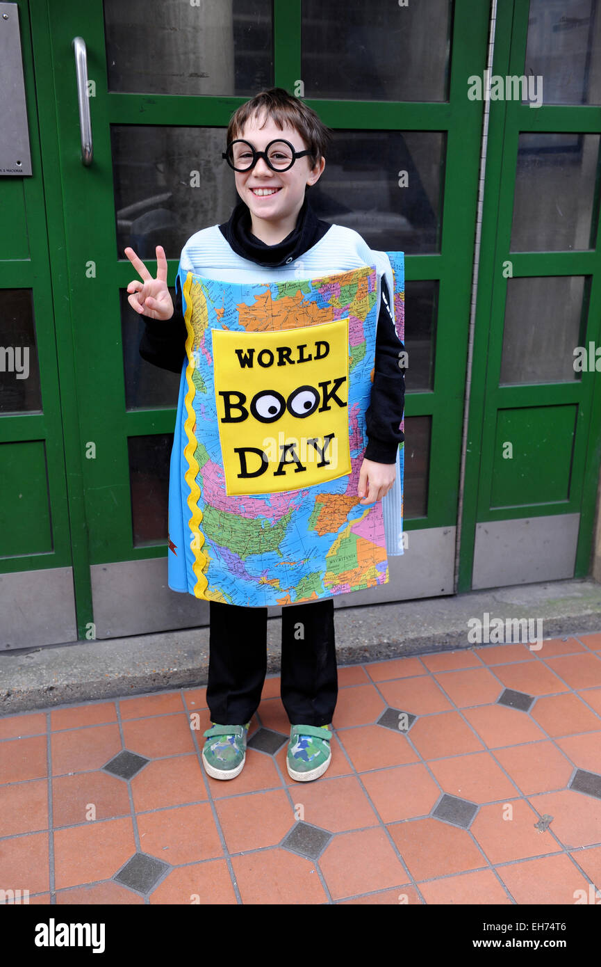 10 year old school boy dressed up as a book for World Book day Stock Photo