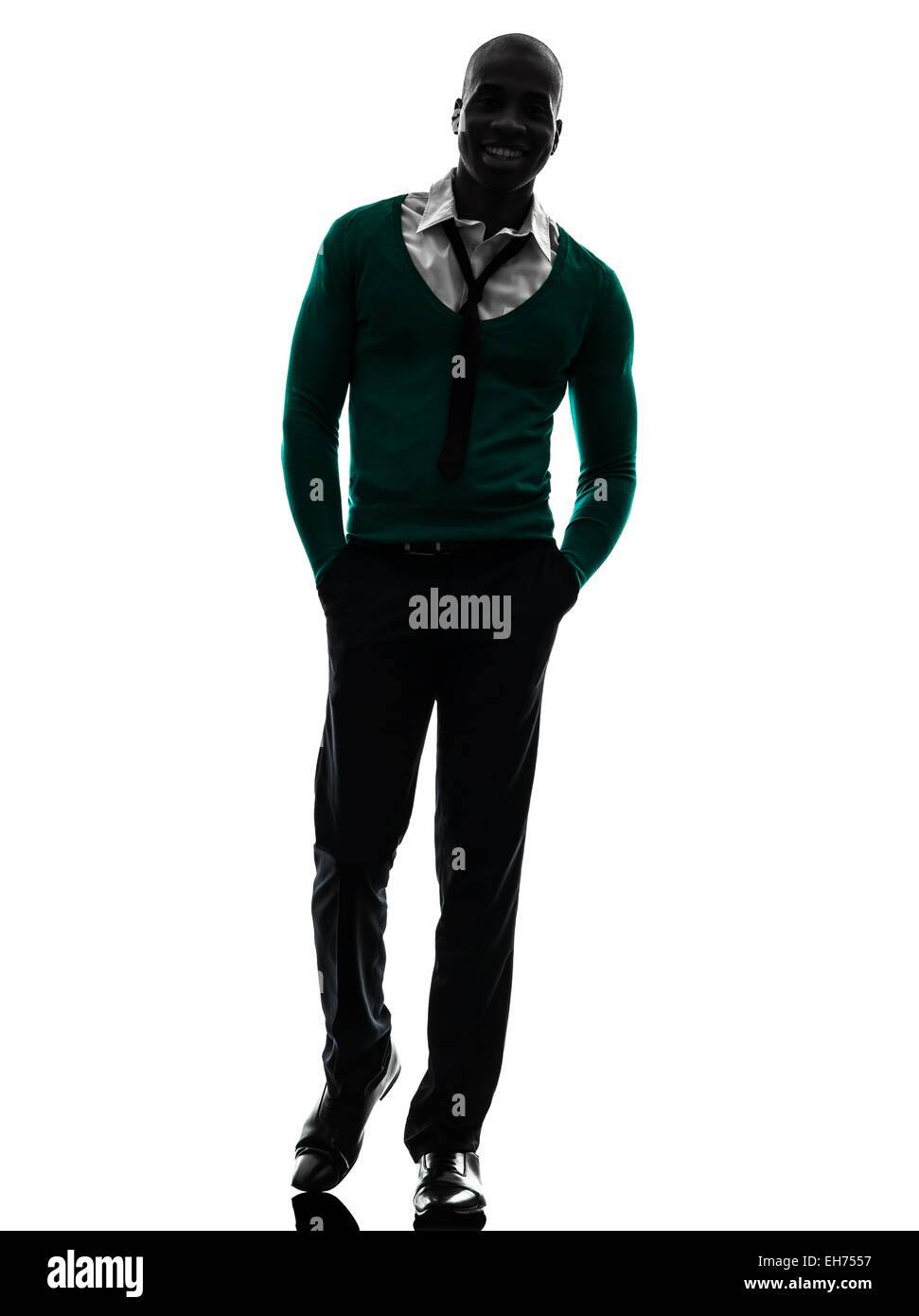 one african black man walking smiling in silhouette studio on white ...