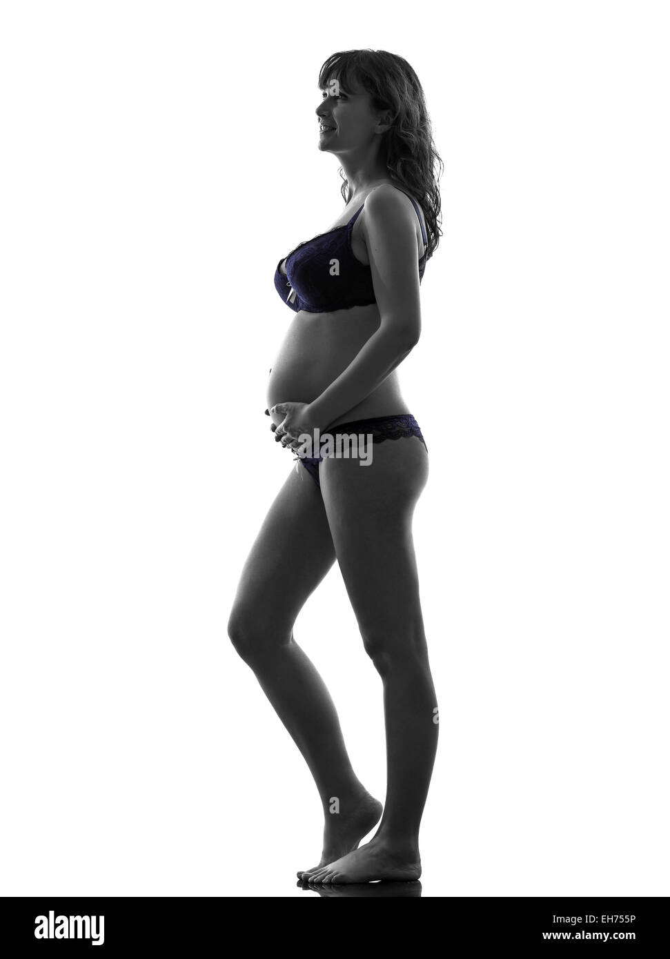 one pregnant woman underwear full length in silhouette studio on white  background Stock Photo - Alamy