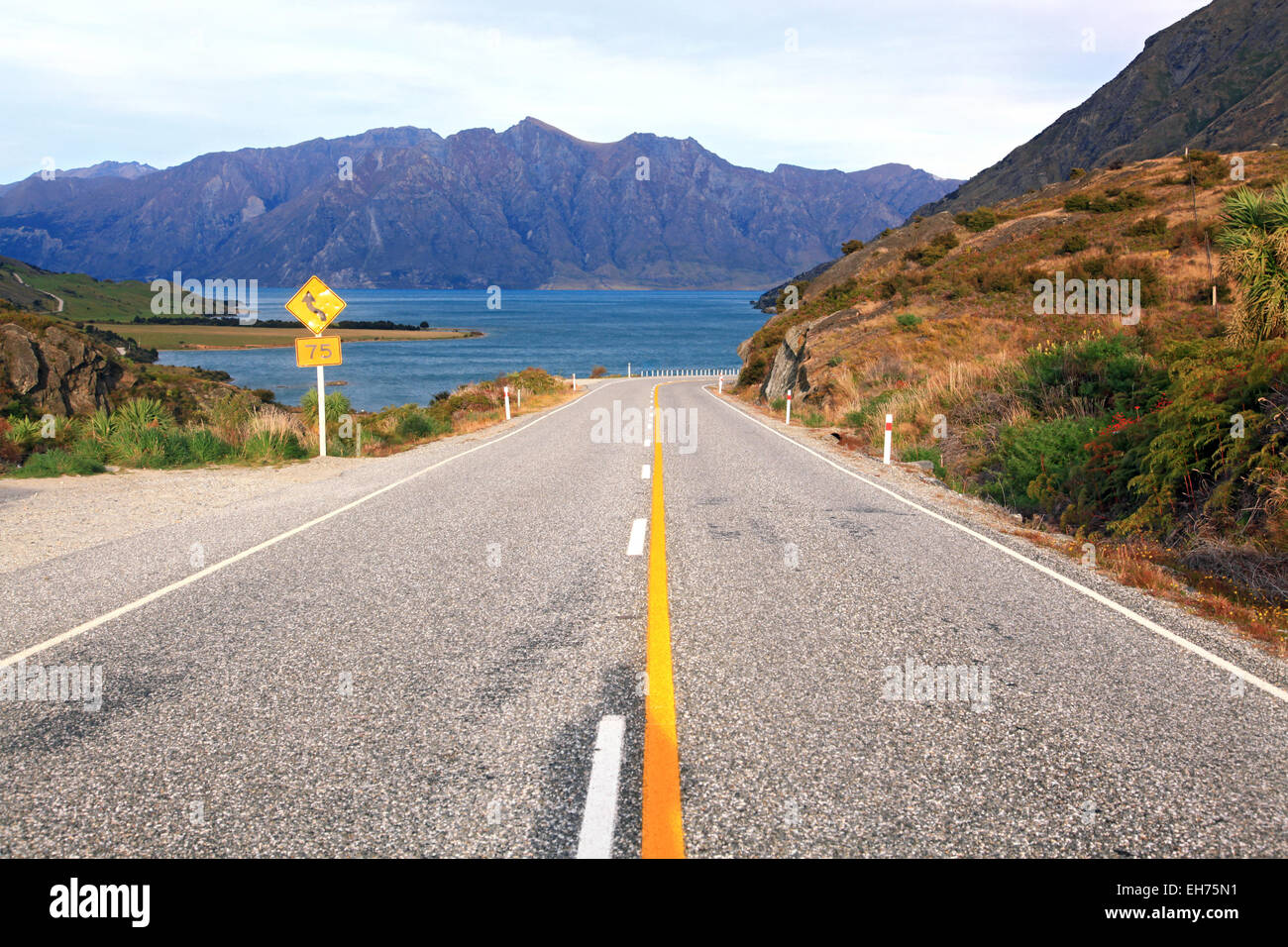 Perspective of Highway Road Freeway stretching to Lake Hawea in Wanaka New Zealand Stock Photo