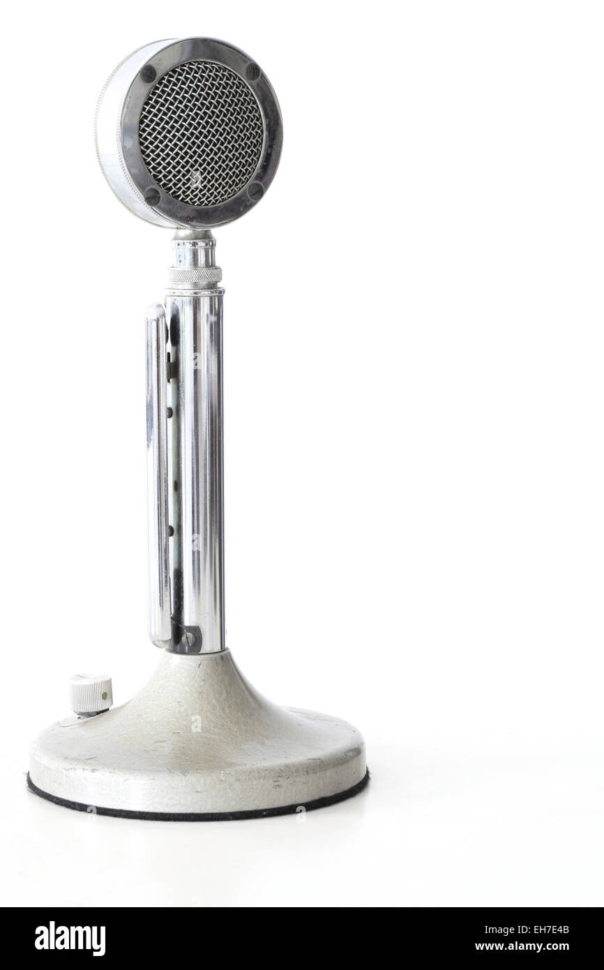 retro Microphone on white table with its reflection Stock Photo