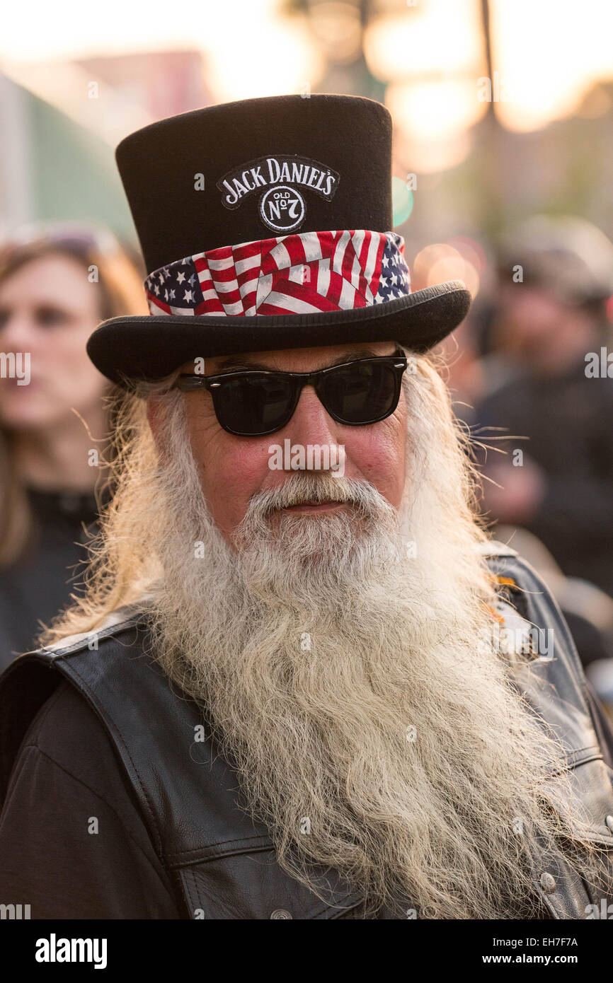 Elderly biker wearing top hat High 