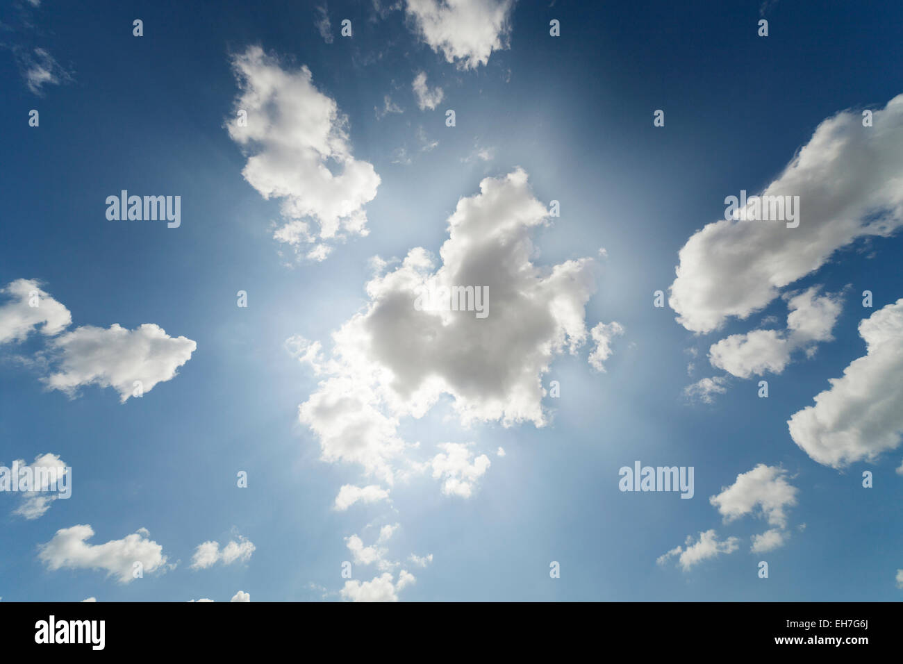 White clouds against a blue sky Stock Photo - Alamy