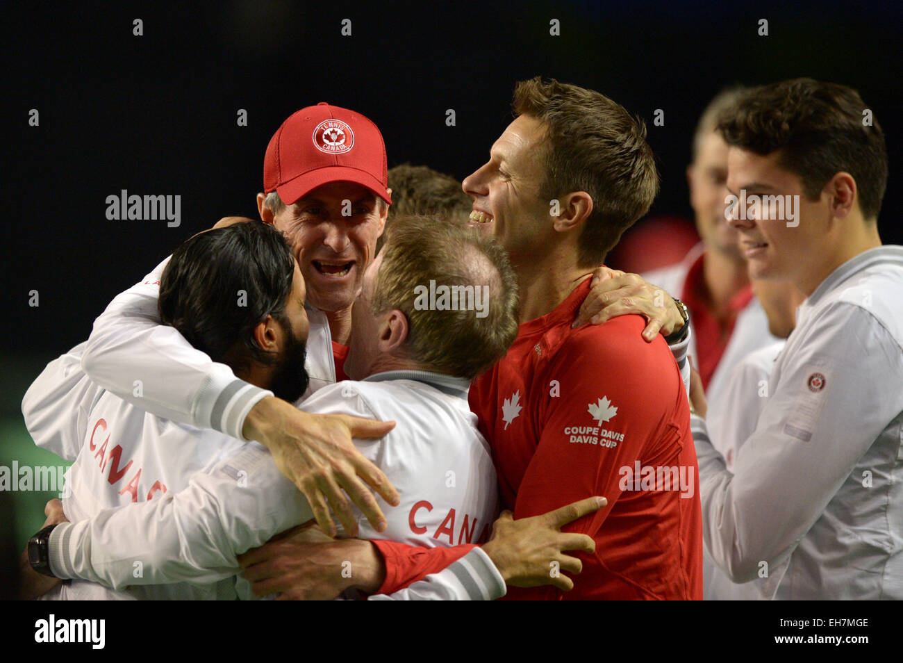 Vancouver, Canada. 8th Mar, 2015. Team Canada celebrates Vasek Pospisil's win over Japan's Go Soeda during Davis Cup tennis tournament in Vancouver, Canada, March 8, 2015. Pospisil defeated Saeda in straight sets 3-0 and advanced Canada to the quarter-finals of Davis Cup. Credit:  Sergei Bachlakov/Xinhua/Alamy Live News Stock Photo