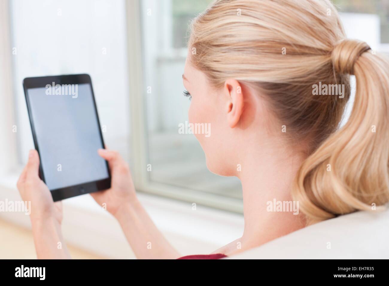 Woman using digital tablet Stock Photo