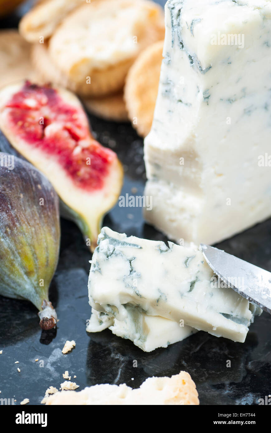 Cheese board with blue cheese, crackers and figs. Stock Photo