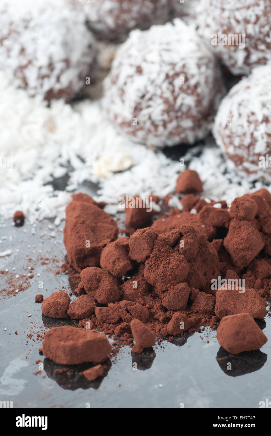 Cocoa powder, one of the ingredients in chocolate and coconut ball. Stock Photo