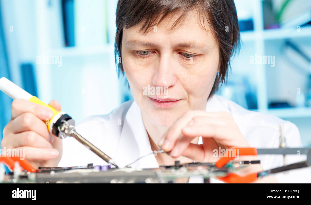 Lab assistant working on circuit board Stock Photo Alamy