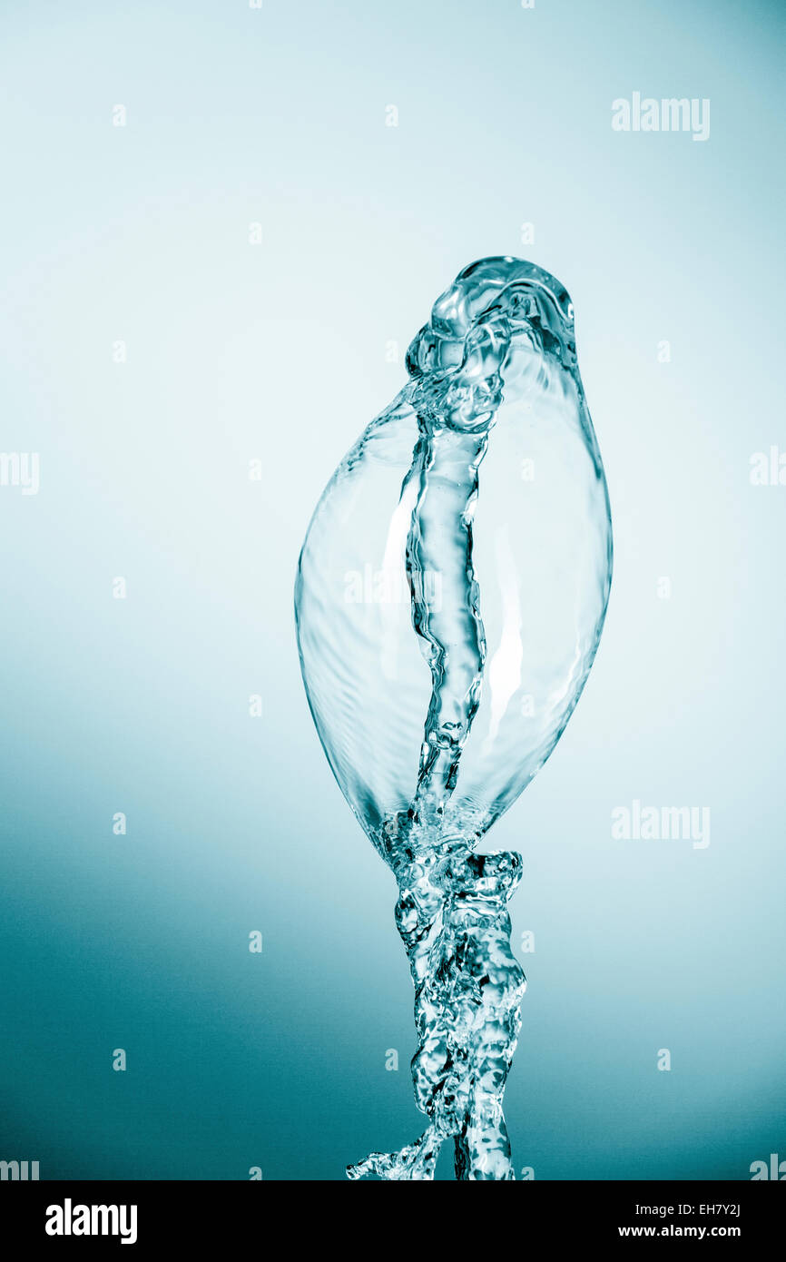Splashes water against blue hi-res stock photography and images - Alamy
