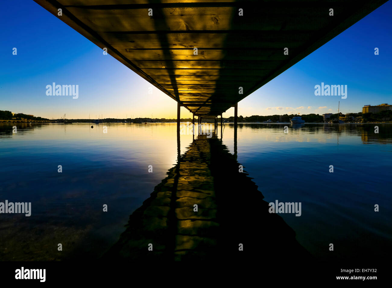 Wooden pier at sunset Stock Photo