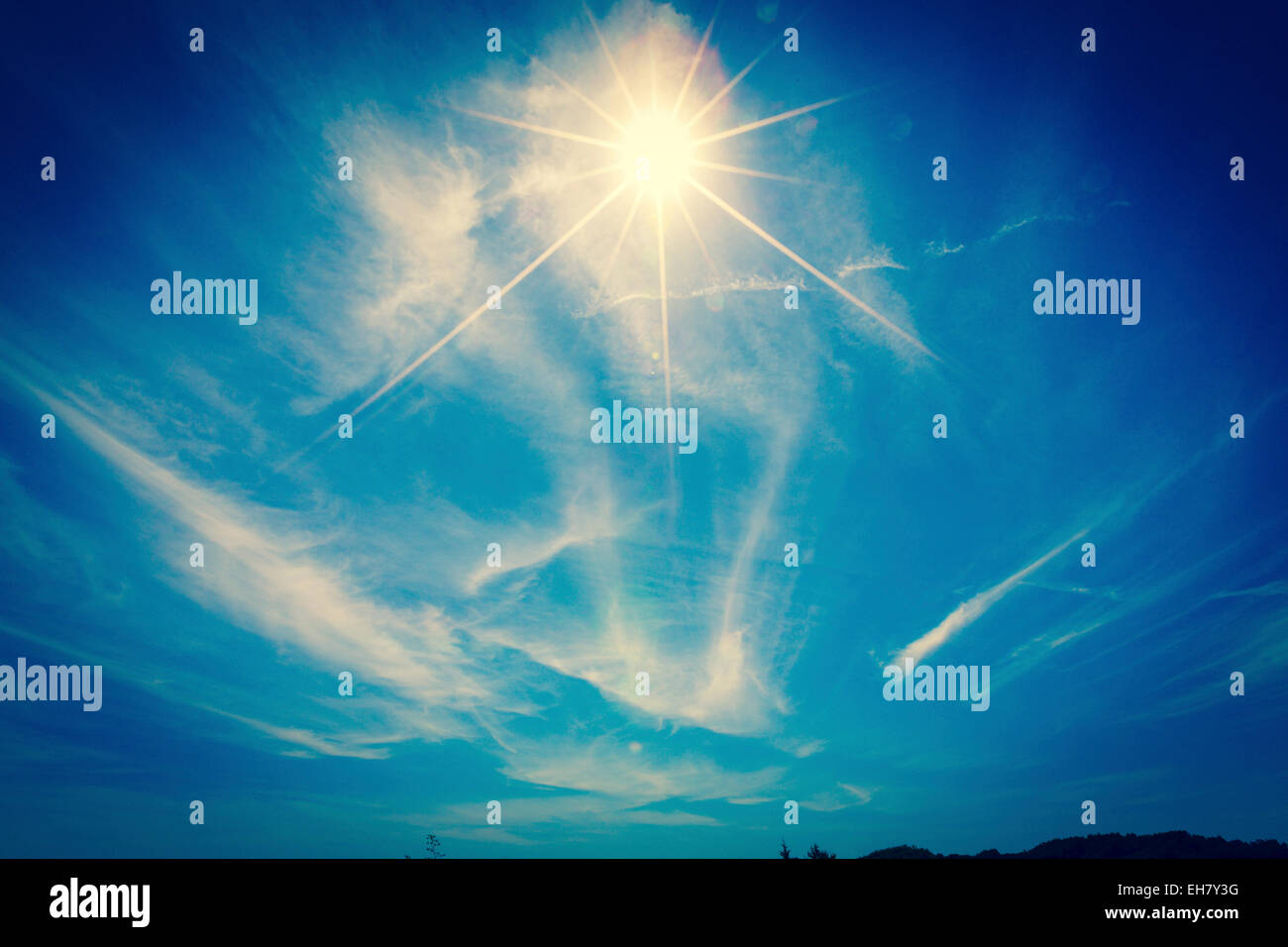 Sunlight and clouds in a blue sky Stock Photo - Alamy