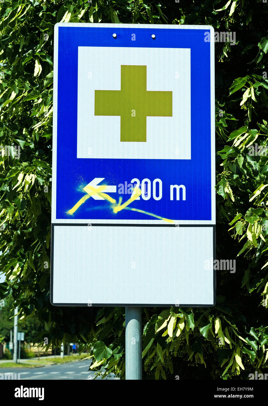 Hospital traffic sign next to the street in the city Stock Photo