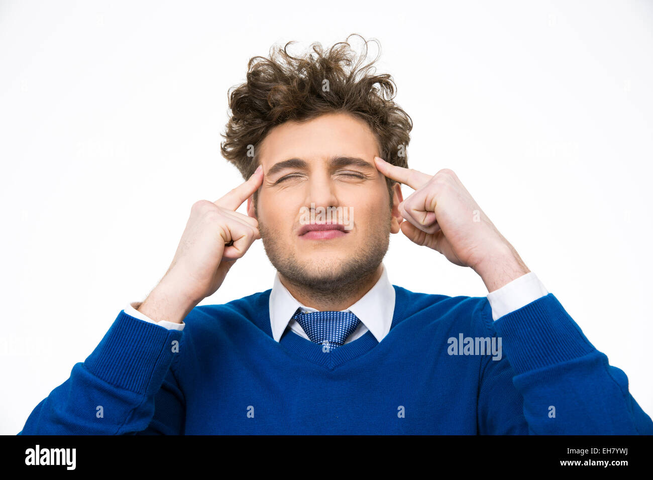 Pensive man with curly hair isolated on a white background Stock Photo