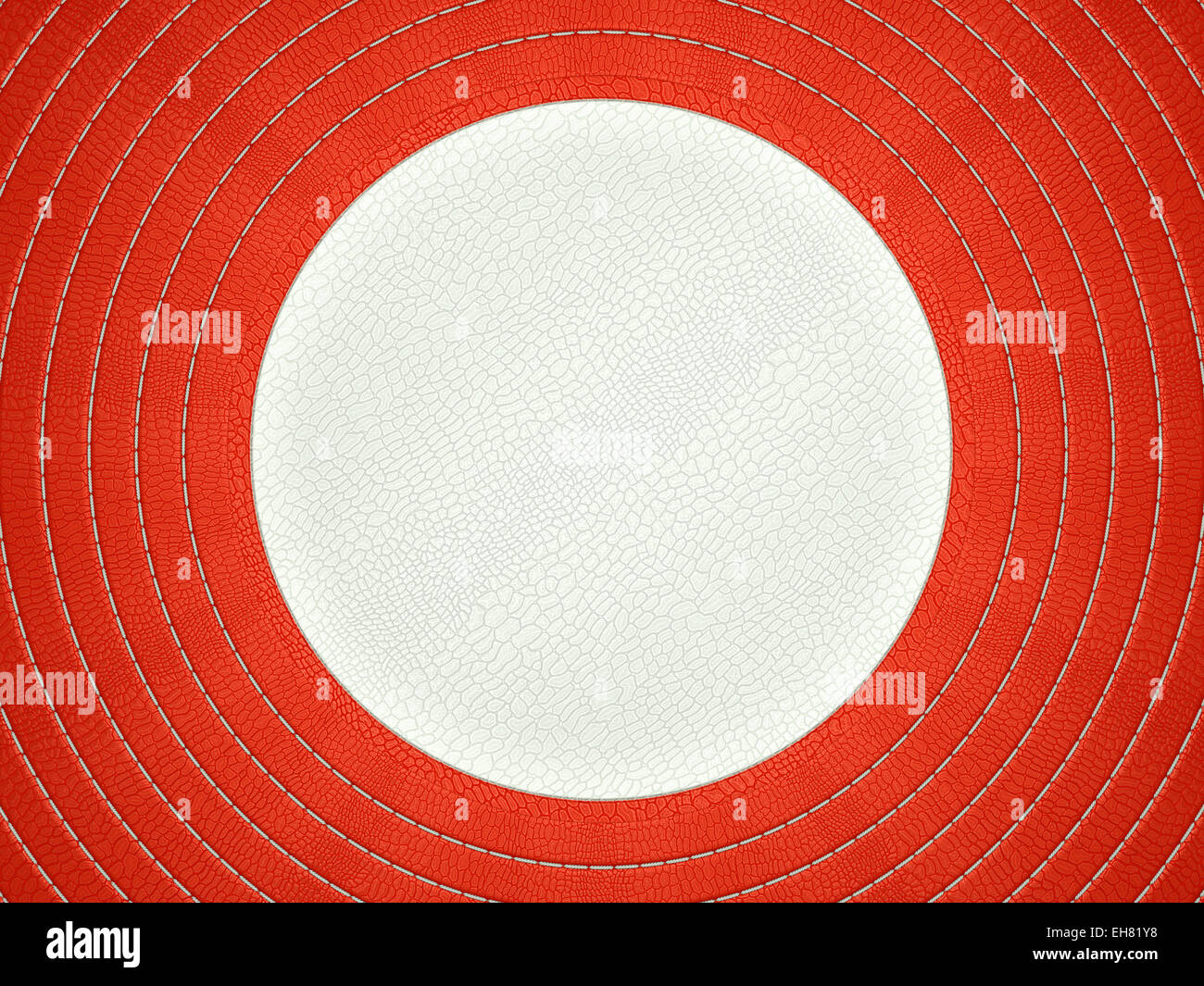 Red and white stitched circle shape on alligator skin. Large resolution Stock Photo