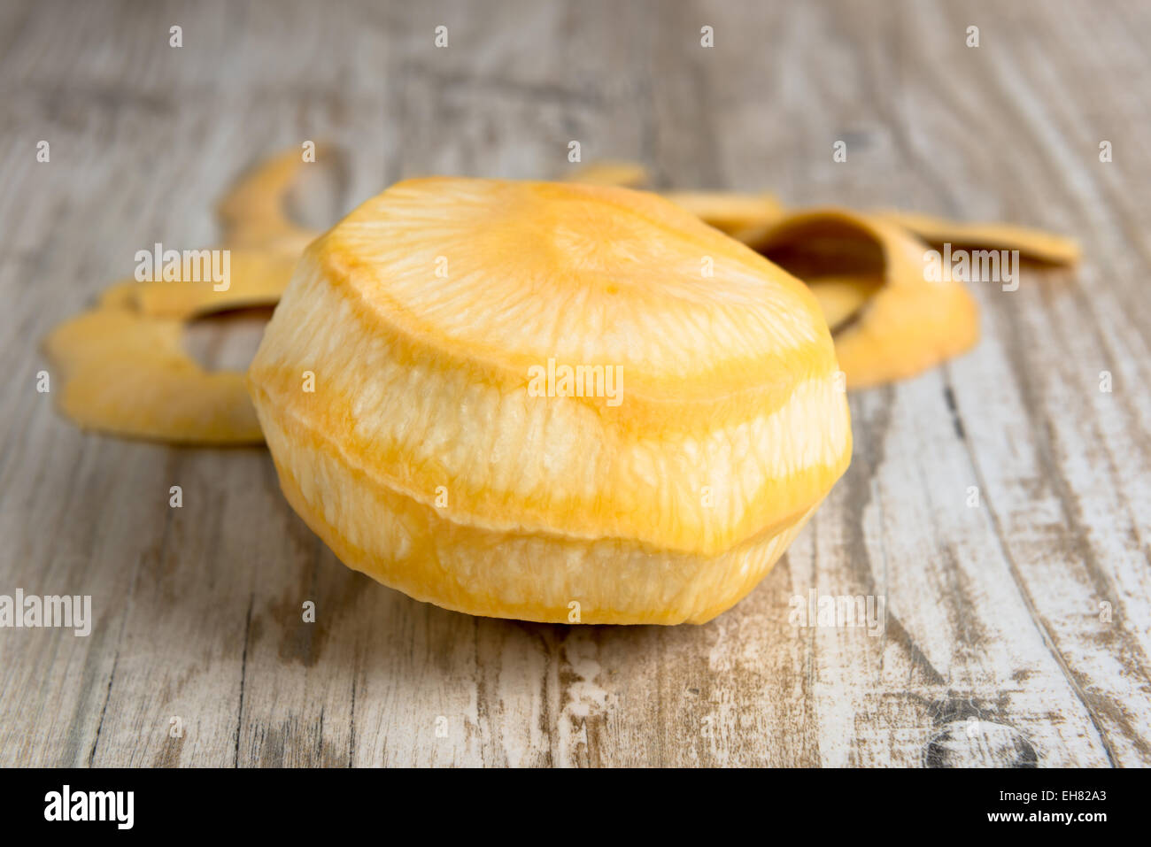 Purified yellow turnips on a wooden table Stock Photo