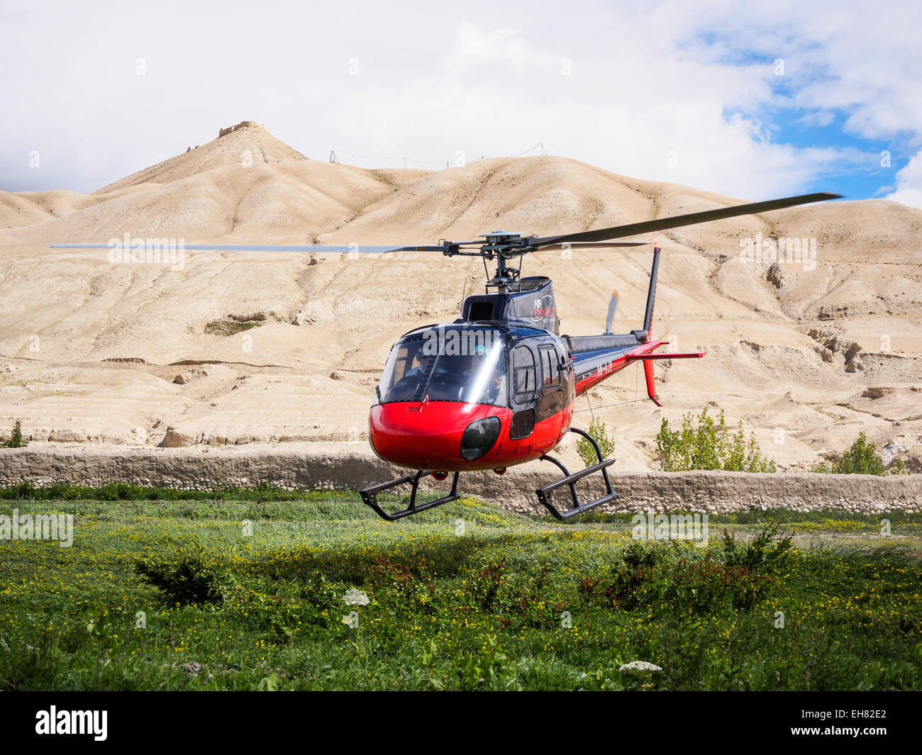 Helicopter taking off from Lo Manthang, Mustang, Nepal Stock Photo