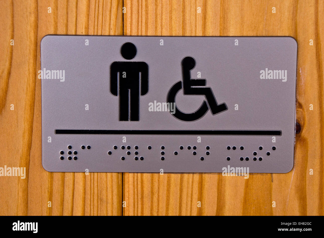 men toilet for disabled, with braille indication for blind people Stock Photo