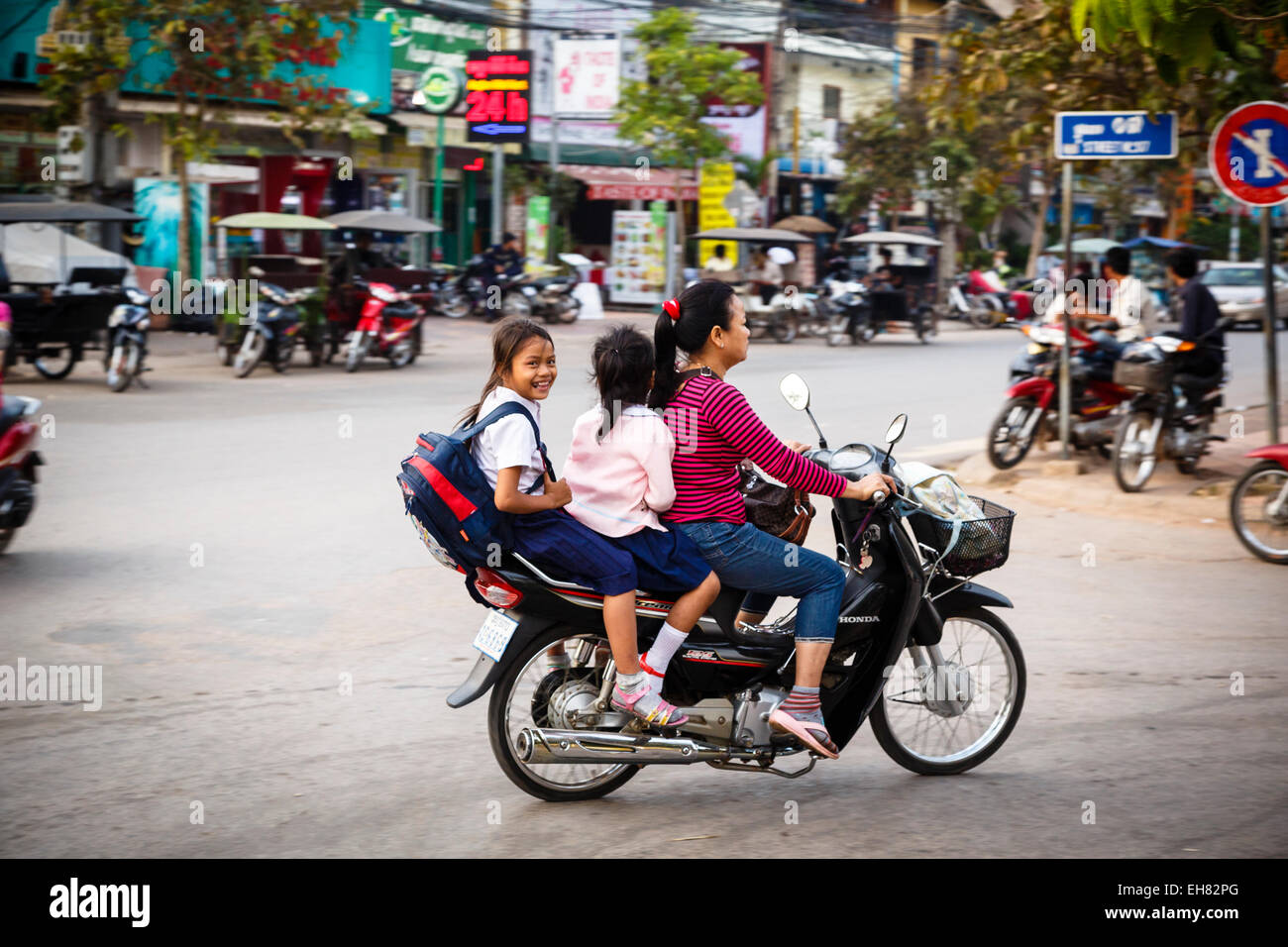 Mother and daughters riding a scooter, Siem Reap, Cambodia, Indochina, Southeast Asia, Asia Stock Photo