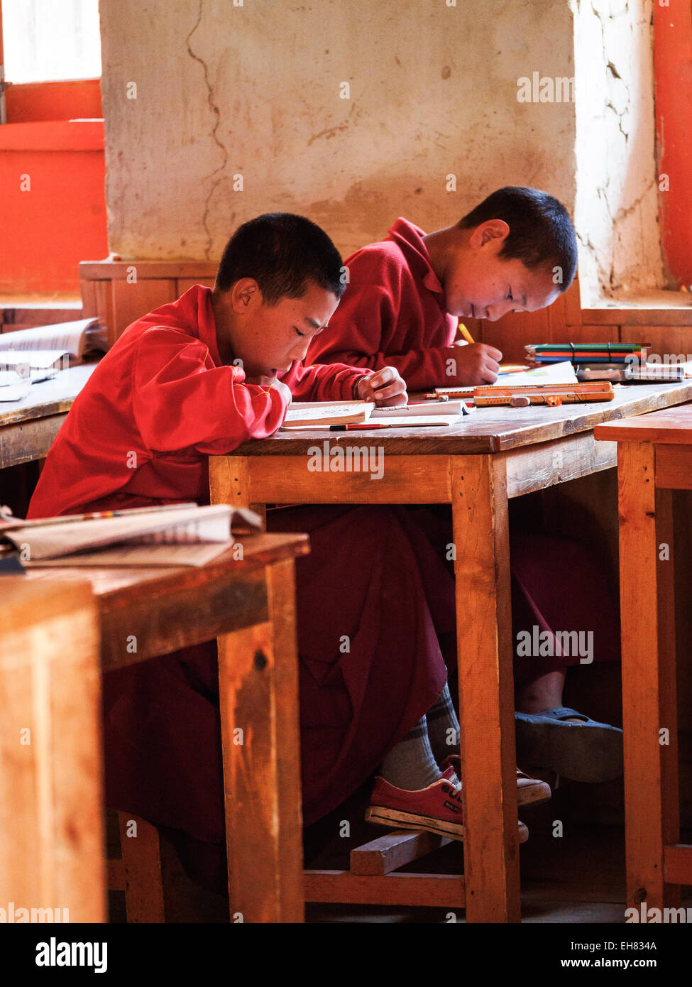 Boys in Buddhist monastery school in Lo Manthang, Mustang, Nepal Stock Photo