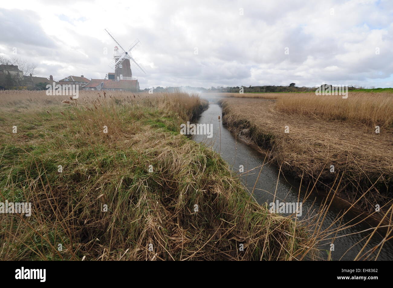 The River Glaven running down from the windmill at Cley-next-the-Sea, north Norfolk. Stock Photo