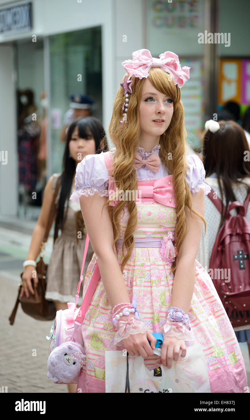Girl in kawaii gothic clothes; lolita clothing; pretty pink fashionable clothes; lolita style fashion Japan; trendy Japanese fashions; Harajuku Tokyo Stock Photo