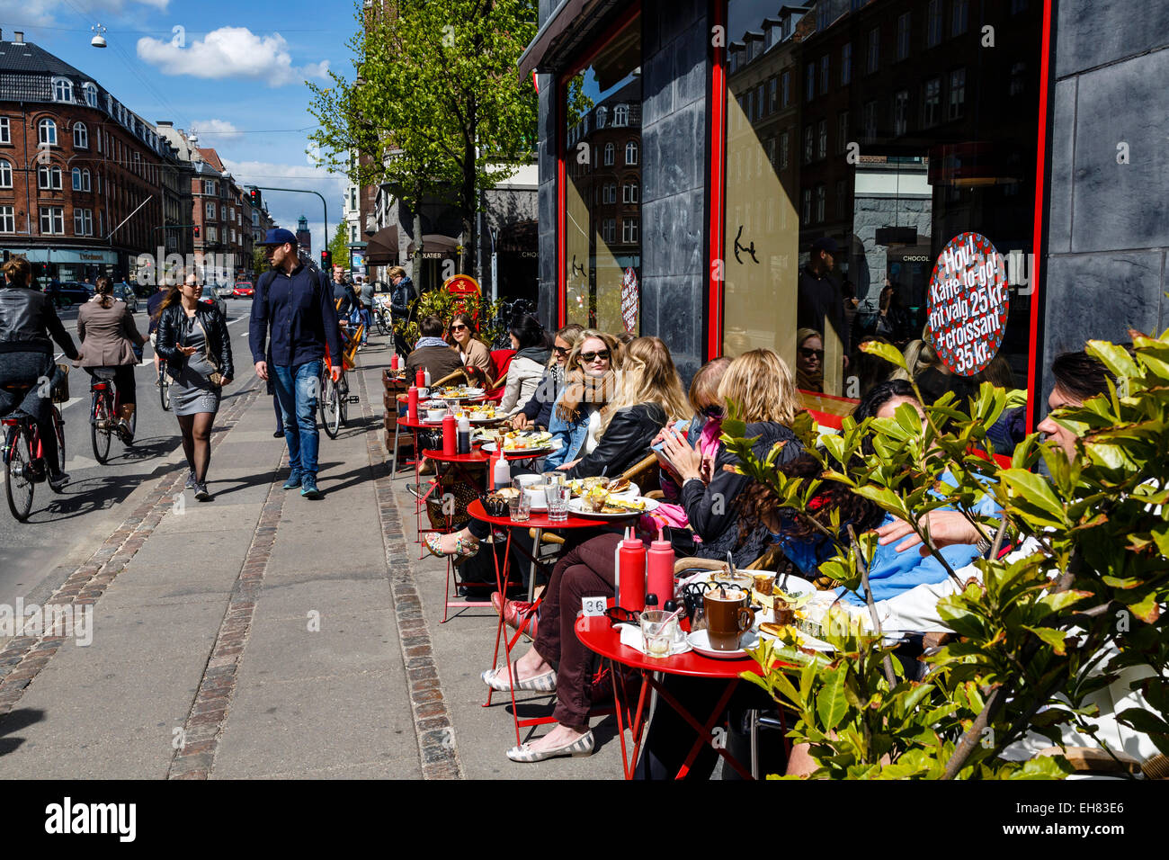 People sitting at the laundromat cafe on Gammel Kongevej, Frederiksberg, Copenhagen, Denmark, Scandinavia, Europe Stock Photo