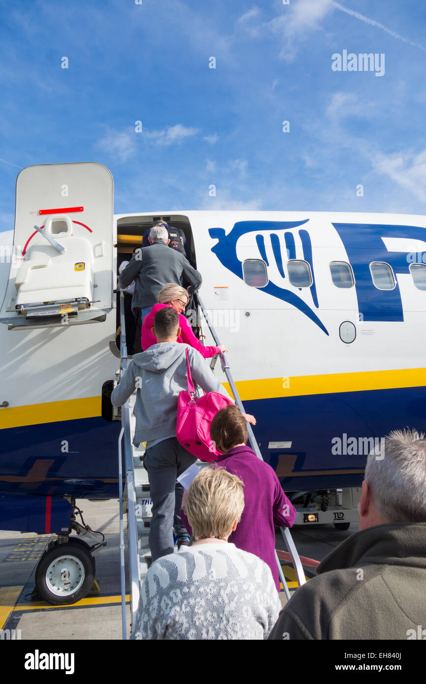 Passengers boarding Ryanair plane at Manchester Airport. England. UK Stock Photo