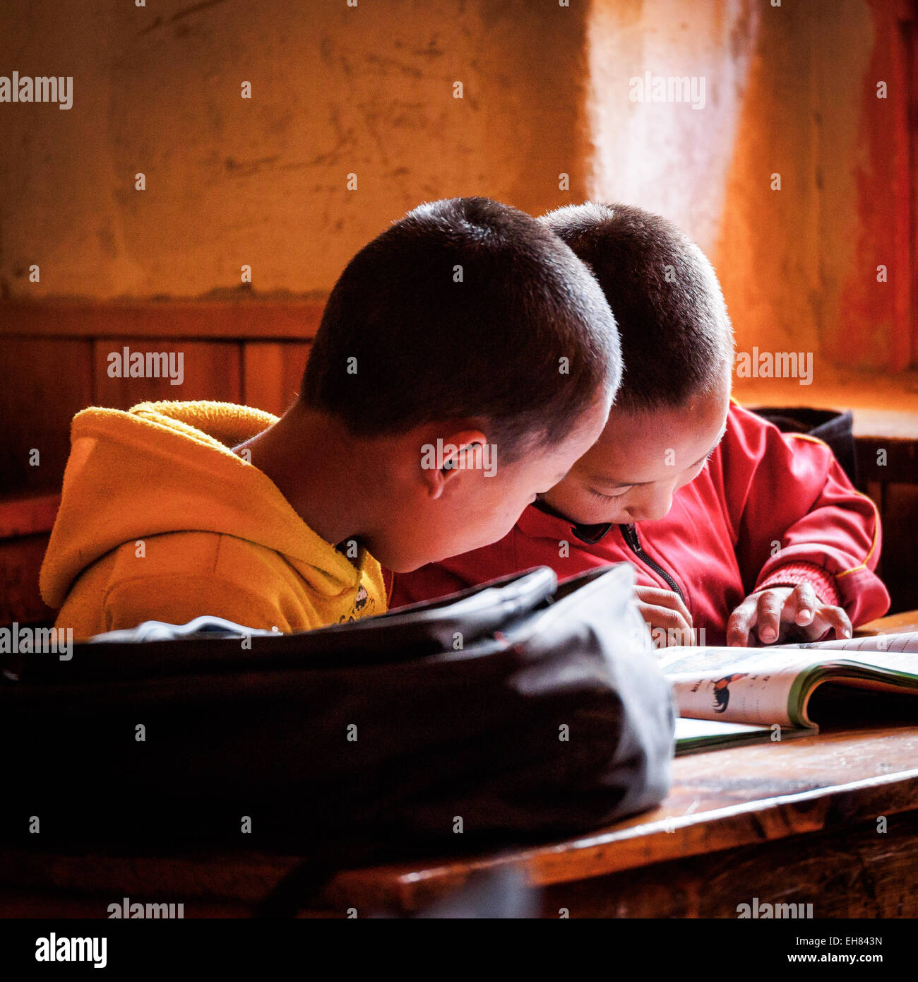 Boys in Buddhist monastery school in Lo Manthang, Mustang, Nepal Stock Photo