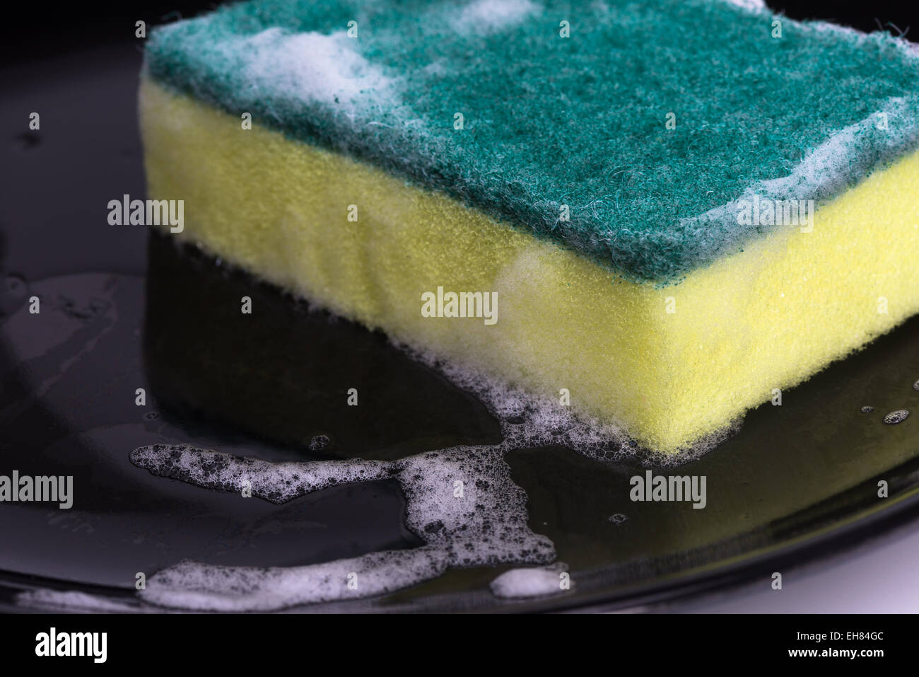 washing dishes with a sponge and dishwashing liquid Stock Photo Alamy