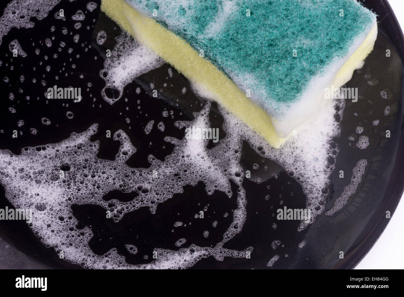 washing dishes with a sponge and dishwashing liquid Stock Photo Alamy