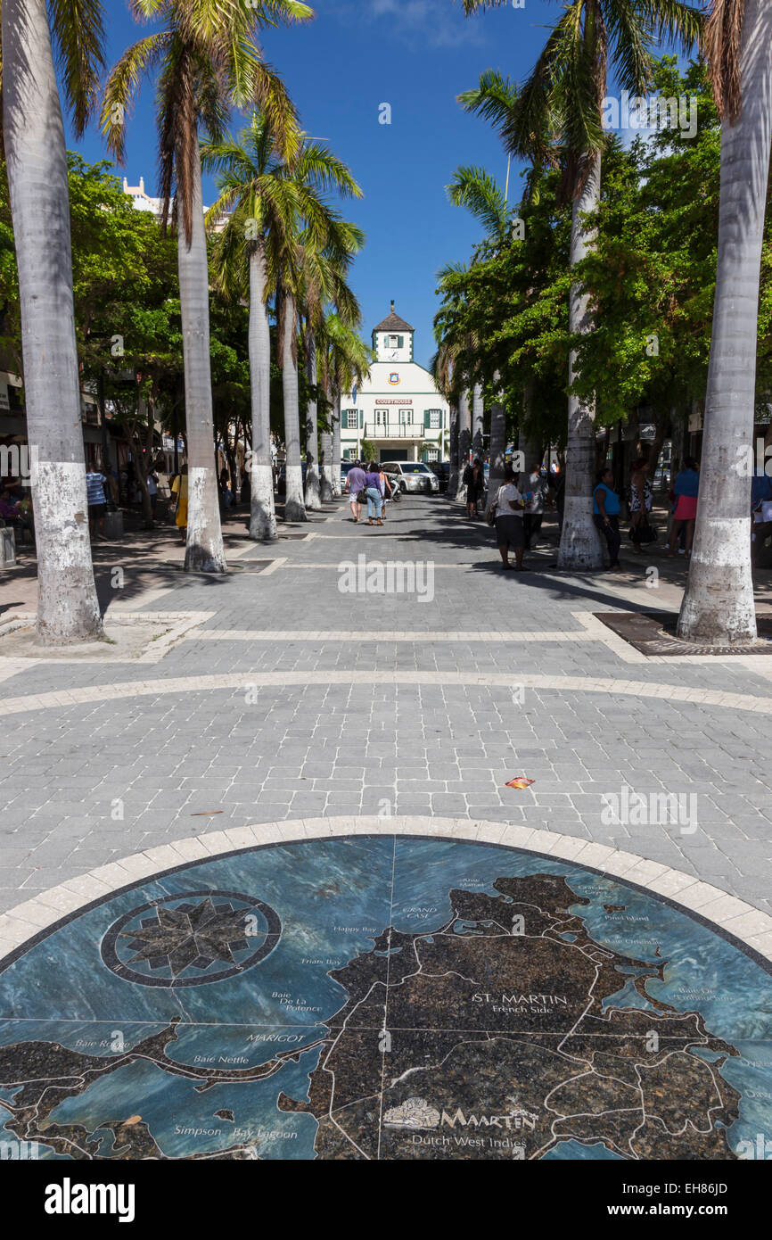 View along palm lined avenue to courthouse with pavement map of the island, Philipsburg, St. Maarten (St. Martin), West Indies Stock Photo