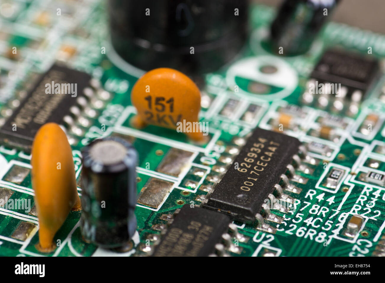 Closeup of electronic circuit board with chips and capacitors