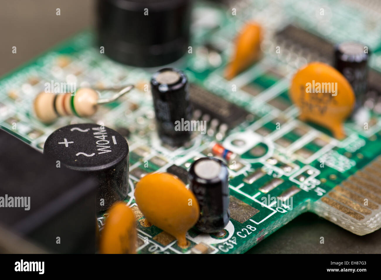 Closeup of electronic circuit board with chips and capacitors