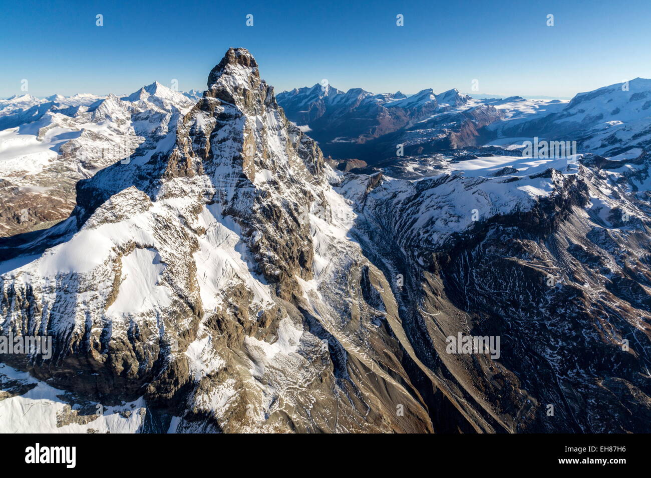 The Matterhorn surrounded by its mountain range covered in snow, Swiss Canton of Valais, Swiss Alps, Switzerland Stock Photo