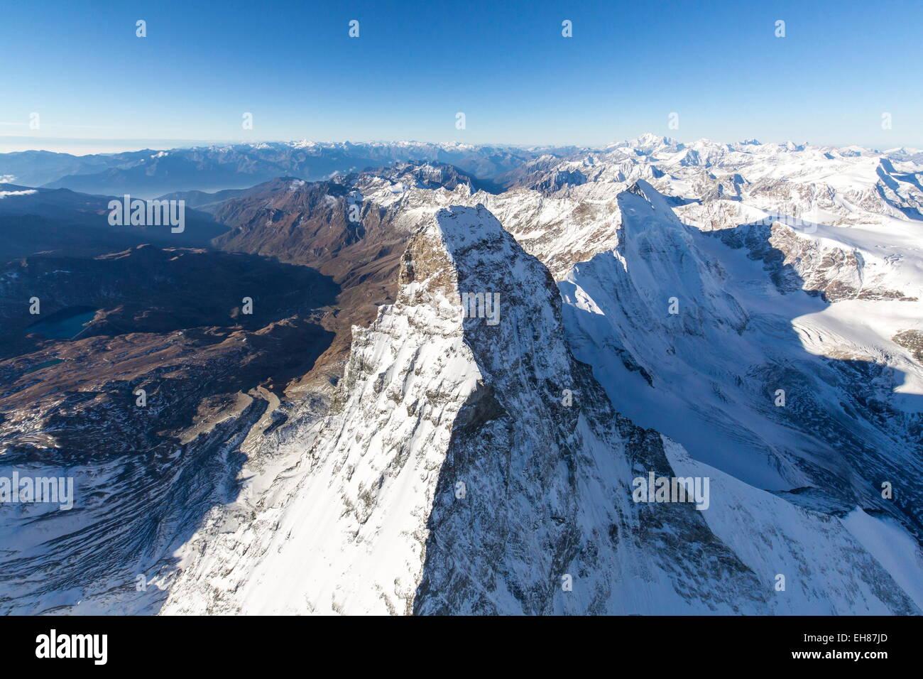 The Matterhorn surrounded by its mountain range covered in snow, Swiss Canton of Valais, Swiss Alps, Switzerland Stock Photo