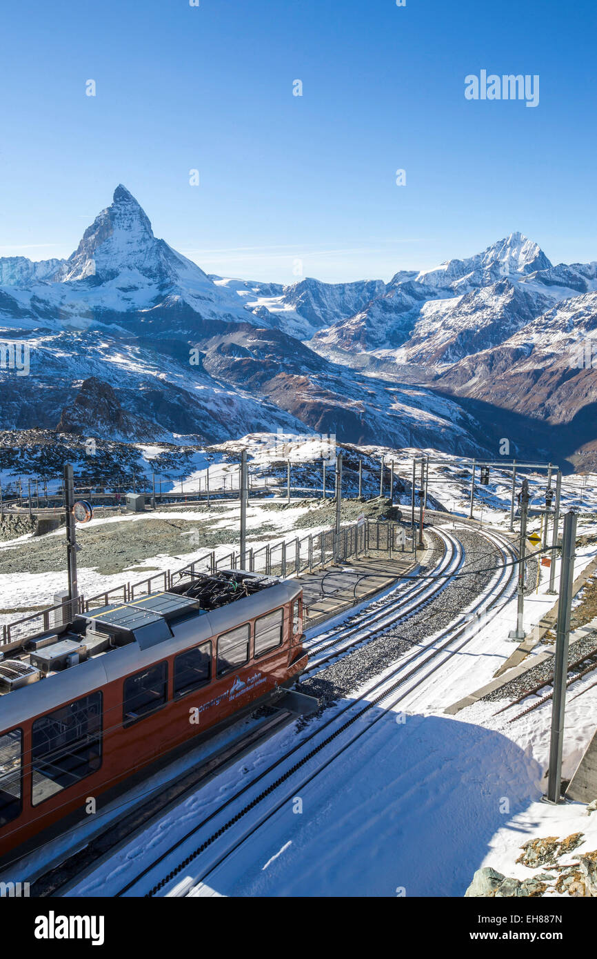 A train from Zermatt approaching the Gornergrat Station facing the majestic shape of the Matterhorn, Valais, Switzerland, Europe Stock Photo