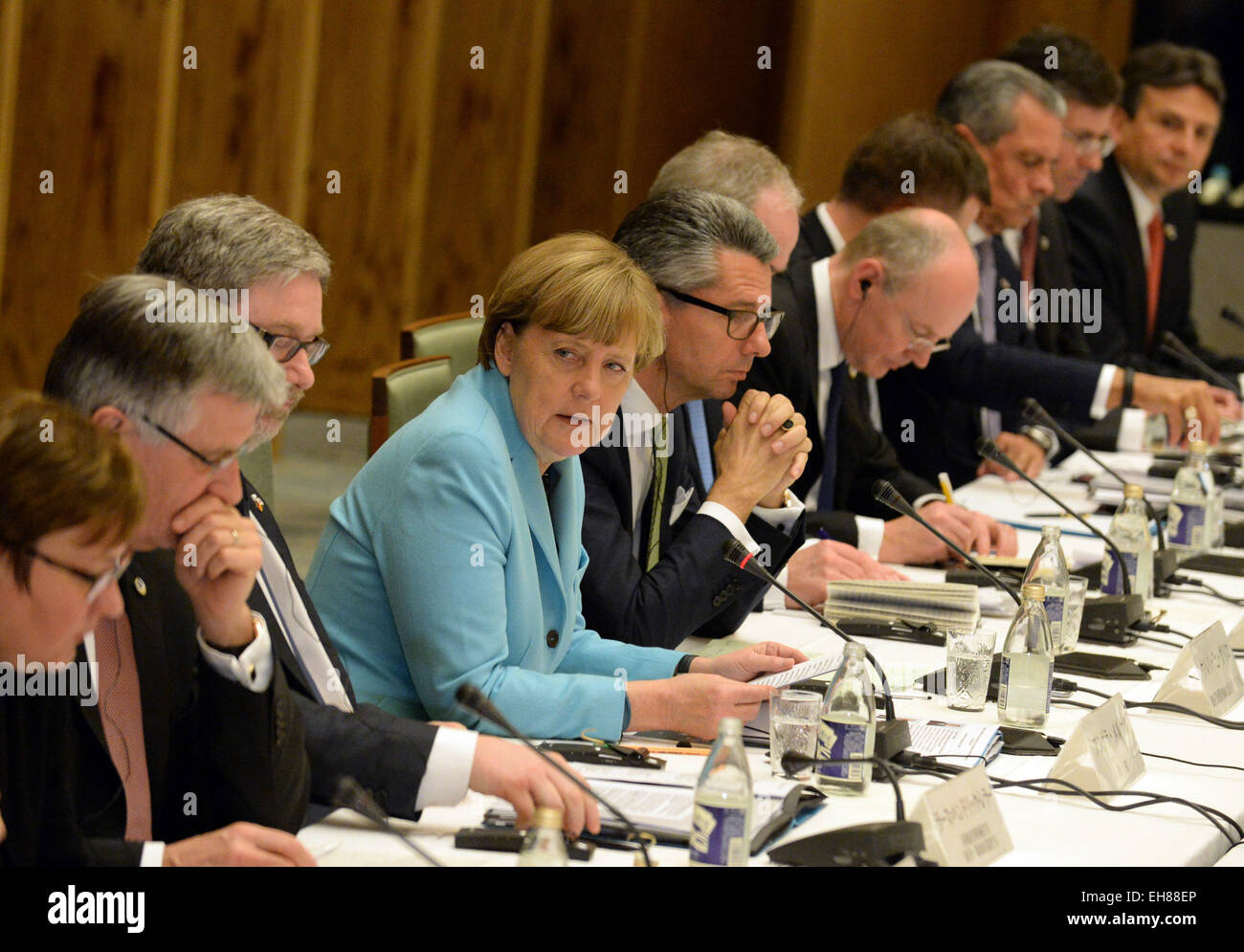 Tokyo, Japan. 9th Mar, 2015. Germany's Chancellor Angela Merkel (4th L) and Japan's Prime Minister Shinzo Abe (not pictured) take part in a meeting with German and Japanese business leaders in Tokyo, Japan, March 9, 2015. © Ma Ping/Xinhua/Alamy Live News Stock Photo