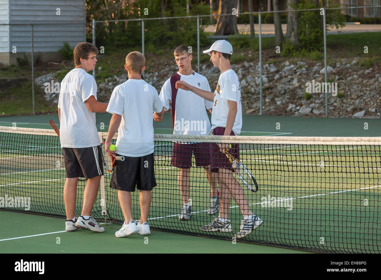 High school boys shaking hands after a tennis match in Kentucky USA Stock Photo