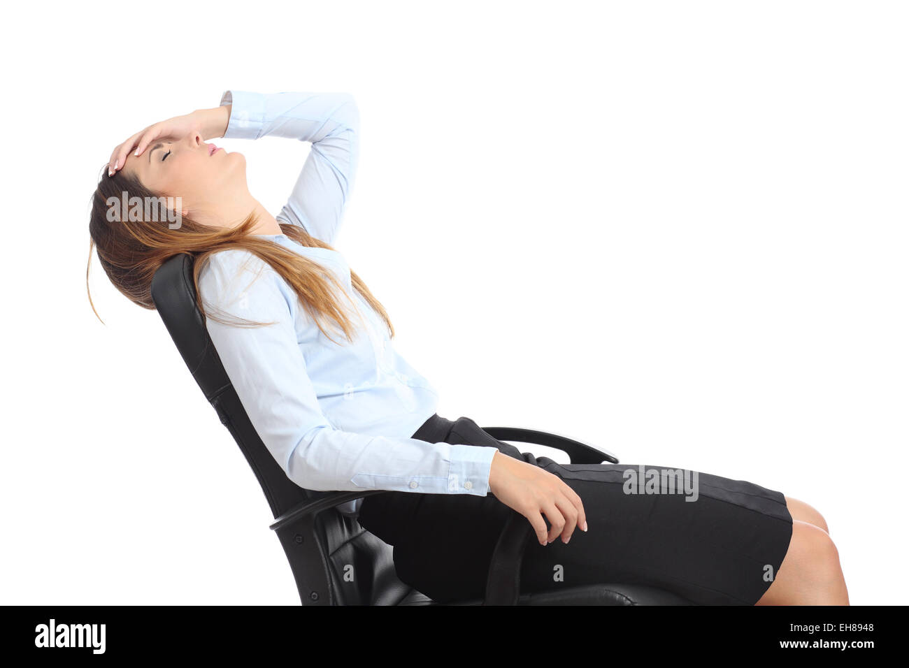 Profile of a tired businesswoman sitting on a chair isolated on a white background Stock Photo