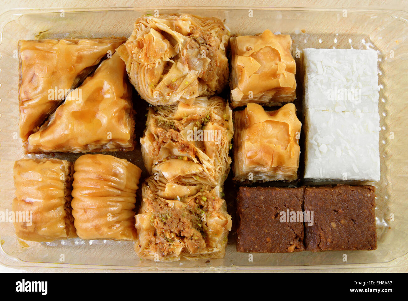 Variety of Turkish baklava in a plastic box Stock Photo