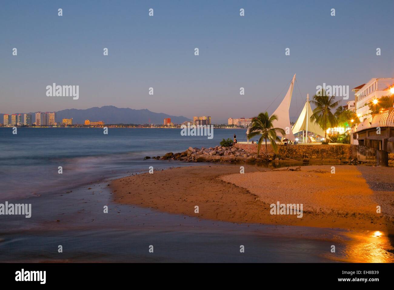 View over beach ast dusk, Downtown, Puerto Vallarta, Jalisco, Mexico, North America Stock Photo