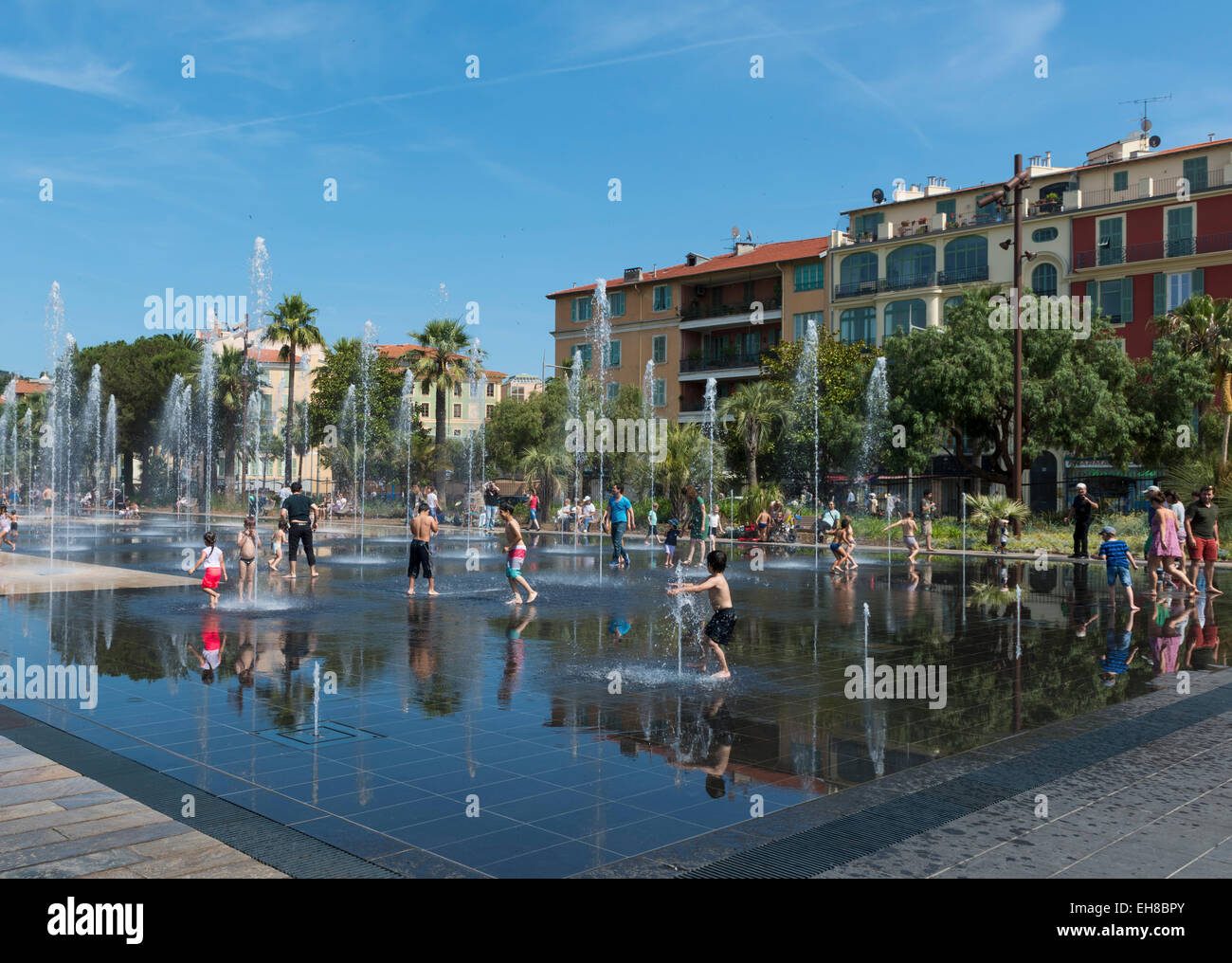 Nice, France, Europe - Promenade du Paillon water mirror fountain in the city center with people in summer Stock Photo