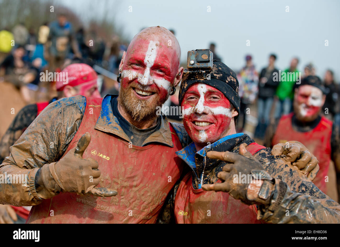 Participants cheer and gesture during the extreme course event 'Braveheart-Battle' in Muennerstadt, Germany, 7 Mrach 2015. Around 2,500 runners have to over come 28 kilometres with 50 challanging obstacles wchih includes freezing cold water, mud pits and burning fire obstacles. The Braveheart-Battle course is considered one of the toughest in Europe. Photo:  Daniel Karmann/dpa Stock Photo